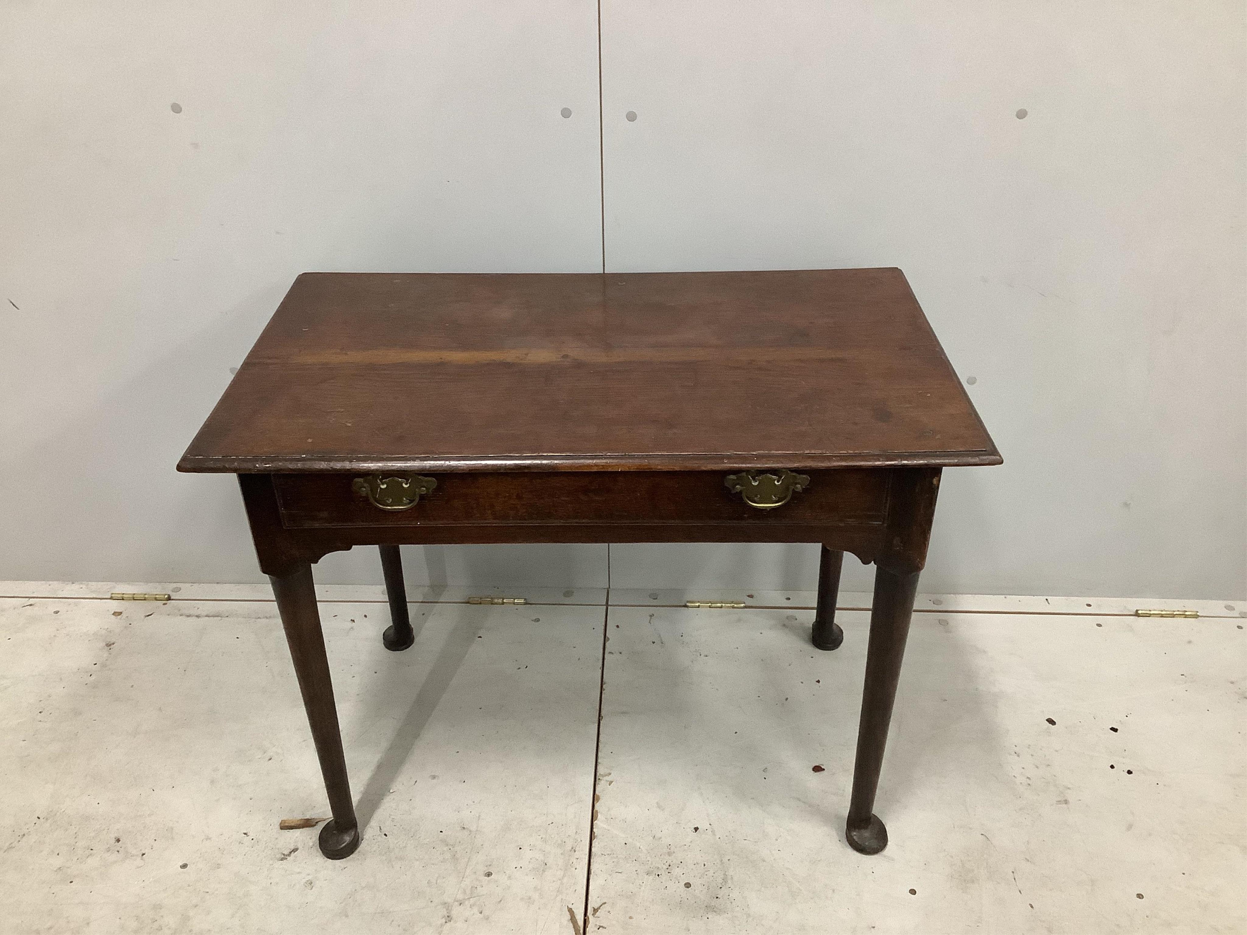 A George III oak side table fitted drawer on pole turned legs with pad feet, width 90cm, depth 54cm, height 69cm. Condition - fair